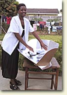 Woman cooking food on a Solar Cooker