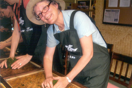 Hand rolling tea leaves on bamboo tray to begin the tea making process for my own Sun Moon Lake black tea.