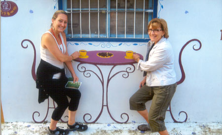 Angela (Ohio) and Lisa (Pa.) having tea trompe l'oeil style near our Teapot Hotel in Rui-Li.
